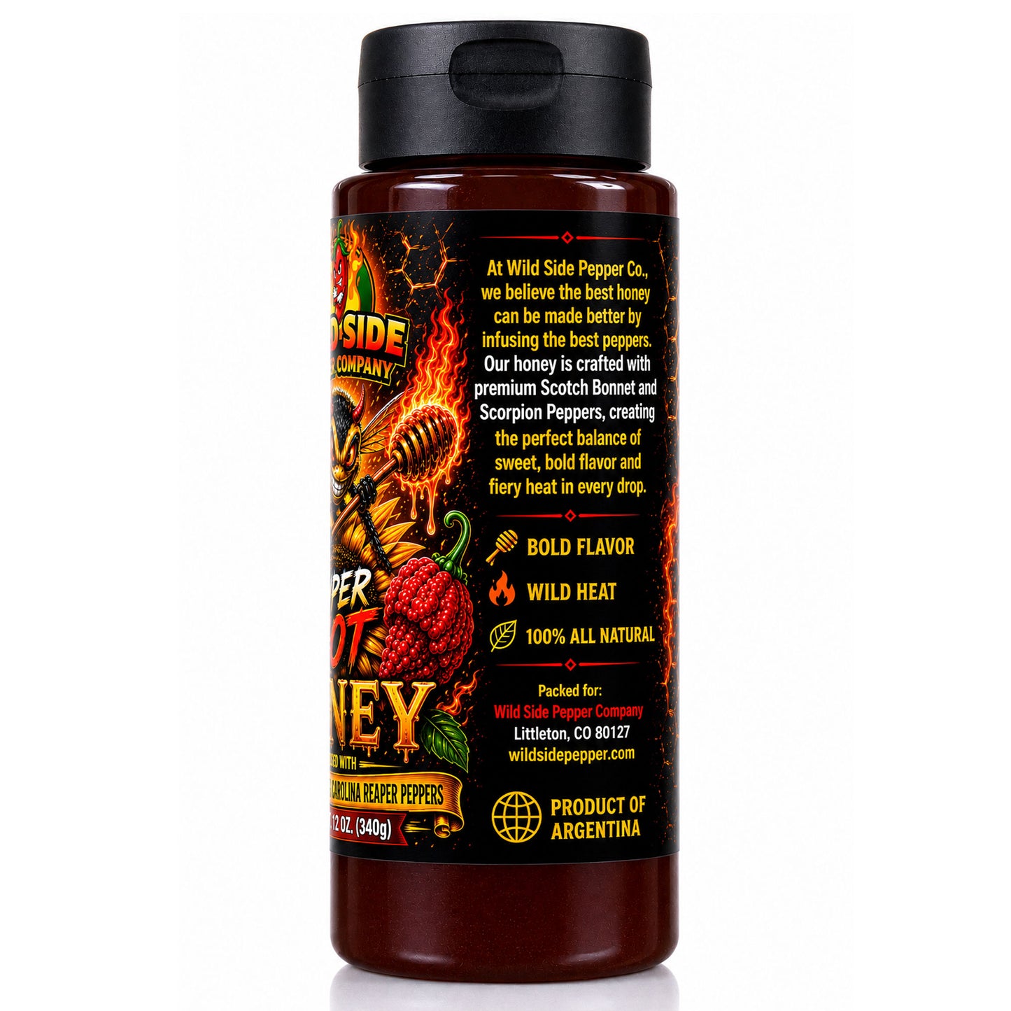 A bottle of Wild Side Pepper Co. Wild Heat Honey in the Creamed Peppers flavor, featuring a black cap and a black label with red, yellow, and orange graphics, set against a plain white background.